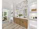 Modern bathroom with double sink vanity, elegant mirror, and shelving with stylish decor at 5217 Waterfall Ct, Gastonia, NC 28056