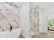 Luxurious bathroom featuring soaking tub, walk-in shower, marble tile, gold accents, and designer finishes at 5217 Waterfall Ct, Gastonia, NC 28056