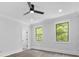 Bright bedroom with two windows offering outdoor views and wood-look flooring at 5217 Waterfall Ct, Gastonia, NC 28056