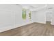 Spacious bedroom with large windows, wood-look floors, and stylish wall trim at 5217 Waterfall Ct, Gastonia, NC 28056