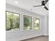 Bedroom featuring three windows, hardwood floors and an overhead ceiling fan at 5217 Waterfall Ct, Gastonia, NC 28056