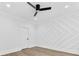 Bright bedroom featuring custom wall decor, modern fan, and wood floors at 5217 Waterfall Ct, Gastonia, NC 28056