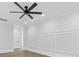 Finished bonus room featuring decorative wall trim and a black ceiling fan at 5217 Waterfall Ct, Gastonia, NC 28056