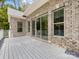 Spacious deck with grey flooring and brick exterior, perfect for outdoor entertaining at 5217 Waterfall Ct, Gastonia, NC 28056