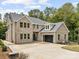 Magnificent two-story brick home featuring a spacious driveway and an attached two-car garage at 5217 Waterfall Ct, Gastonia, NC 28056