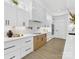 Beautiful kitchen with white cabinets, subway tile backsplash, and modern stainless steel appliances at 5217 Waterfall Ct, Gastonia, NC 28056