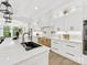 Bright kitchen with stainless steel appliances, white cabinets, and a view of the backyard at 5217 Waterfall Ct, Gastonia, NC 28056