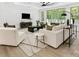 Bright living room features large windows, a ceiling fan, and stylish, modern decor at 5217 Waterfall Ct, Gastonia, NC 28056