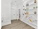 Elegant wine rack display with custom shelving, recessed lighting, and plenty of storage space at 5217 Waterfall Ct, Gastonia, NC 28056