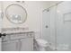 Beautifully updated bathroom with glass shower, granite countertop, and modern fixtures at 530 E 9Th St, Charlotte, NC 28202