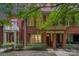 Charming red brick townhomes with inviting front porches and lush, mature landscaping at 530 E 9Th St, Charlotte, NC 28202