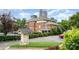 A multi-unit building with brick facade and ample parking, set against a city skyline at 530 E 9Th St, Charlotte, NC 28202
