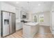 Modern kitchen with stainless steel appliances, grey cabinetry, and a spacious island at 530 E 9Th St, Charlotte, NC 28202
