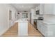Bright kitchen features white cabinets, stainless steel appliances, and granite countertops at 530 E 9Th St, Charlotte, NC 28202