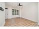 Neutral living room featuring hardwood floors, recessed lighting, and abundant natural light at 530 E 9Th St, Charlotte, NC 28202