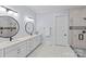 Bathroom with double vanity, decorative mirrors, and tiled walk-in shower at 5638 Timber Ln, Charlotte, NC 28270