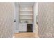 Charming butler's pantry with open shelving, cabinetry, and a wine fridge at 5638 Timber Ln, Charlotte, NC 28270