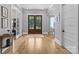Grand entryway features hardwood floors and elegant archways leading to dining at 5638 Timber Ln, Charlotte, NC 28270