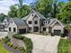 Stunning brick home boasts a spacious driveway and attached two-car garage at 5638 Timber Ln, Charlotte, NC 28270