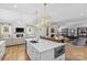 Open concept kitchen with hardwood floors, stainless appliances, and view into the living room at 5638 Timber Ln, Charlotte, NC 28270