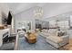 Spacious living room with vaulted ceiling, fireplace, and open access to the kitchen at 5638 Timber Ln, Charlotte, NC 28270