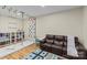 Recreation room with climbing wall, rope ladder, wood floors and ample space for activities at 5638 Timber Ln, Charlotte, NC 28270