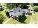 An aerial view of the charming brick home with a large, green yard, nice landscaping, and detached garage at 628 Stamie Dr, Chester, SC 29706