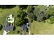 Expansive aerial view showcasing the property, mature trees, and in-ground pool at 628 Stamie Dr, Chester, SC 29706
