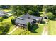 Aerial view showcasing house with mature trees, well-manicured lawn, and a covered porch at 628 Stamie Dr, Chester, SC 29706