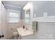 Bright bathroom featuring a white vanity, tiled walls, and a shower with a curtain at 628 Stamie Dr, Chester, SC 29706