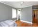 Comfortable bedroom with hardwood floors, neutral walls, and an adjoining bathroom at 628 Stamie Dr, Chester, SC 29706