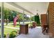Cozy front porch featuring brick columns, comfortable seating, and views of the neighborhood at 628 Stamie Dr, Chester, SC 29706