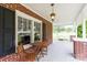 Charming brick home featuring a covered front porch with an inviting seating area at 628 Stamie Dr, Chester, SC 29706