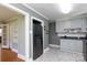 Bright kitchen featuring stainless steel appliances, white cabinets, and tile floor at 628 Stamie Dr, Chester, SC 29706