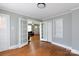 Bright living area with hardwood flooring, French doors, and built-in shelving at 628 Stamie Dr, Chester, SC 29706