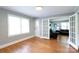 Open living space with hardwood floors and view into adjacent room through French doors at 628 Stamie Dr, Chester, SC 29706