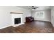 Cozy living room featuring hardwood floors, a decorative fireplace, and a large window at 628 Stamie Dr, Chester, SC 29706