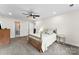 Neutral bedroom with natural light and en-suite bathroom provides a peaceful ambiance at 7144 Marlin St, Gastonia, NC 28056