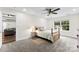 Bright bedroom with neutral walls, carpet, and light colored furniture offers a calming retreat at 7144 Marlin St, Gastonia, NC 28056