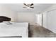 Spacious carpeted bedroom features a fan, a door to another room and a closet at 7144 Marlin St, Gastonia, NC 28056