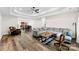 A spacious living room boasting a tray ceiling, hardwood floors, and comfortable seating at 7144 Marlin St, Gastonia, NC 28056