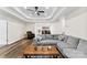 A spacious living room boasting a tray ceiling, hardwood floors, and comfortable seating at 7144 Marlin St, Gastonia, NC 28056