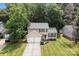 Aerial view of the house showcasing its well-manicured lawn and proximity to mature trees at 7212 Morsey Ct, Charlotte, NC 28269