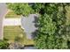 Aerial view of a well-maintained home with a large lawn and mature trees at 7212 Morsey Ct, Charlotte, NC 28269