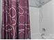 Bathroom shower featuring a decorative purple shower curtain with white tiled walls at 7212 Morsey Ct, Charlotte, NC 28269
