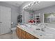 Bright bathroom with double vanity, large mirror, and separate shower and tub at 7212 Morsey Ct, Charlotte, NC 28269