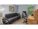 Versatile bedroom featuring a futon, desk, and natural light, ideal for work or rest at 7212 Morsey Ct, Charlotte, NC 28269