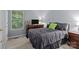 Cozy bedroom with comfortable bed, dresser, and window, creating a relaxing atmosphere at 7212 Morsey Ct, Charlotte, NC 28269