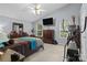 Light-filled bedroom with high ceiling, neutral carpet, and matching wood furniture set at 7212 Morsey Ct, Charlotte, NC 28269