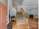 Spacious foyer showcases a staircase with wooden banisters and views into the living areas at 7212 Morsey Ct, Charlotte, NC 28269